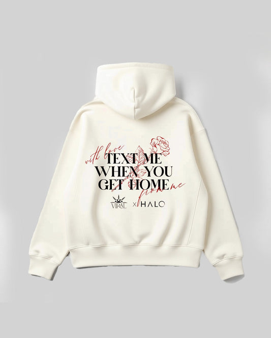 White hoodie with text and graphics on a gray background with text me when you get home written on it